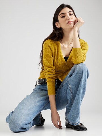 Cardigan King Louie en jaune