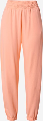 Champion Authentic Athletic Apparel Pants in Orange: front