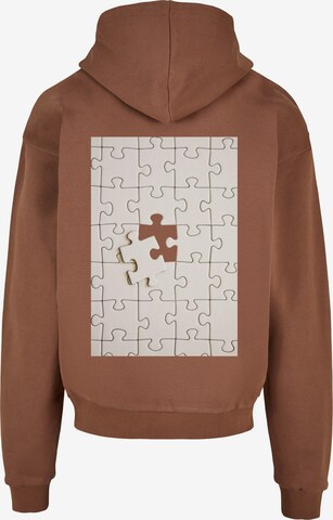 Merchcode Sweatshirt 'Missing Piece' in Braun