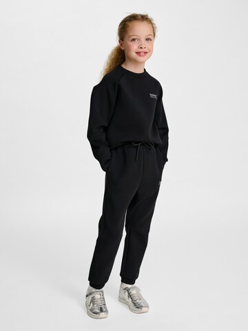 Effilé Pantalon de sport Hummel en noir
