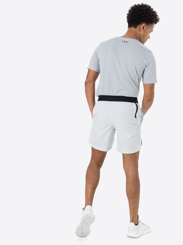 Regular Pantalon de sport UNDER ARMOUR en blanc