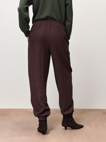 Next Loosefit Hose in Braun