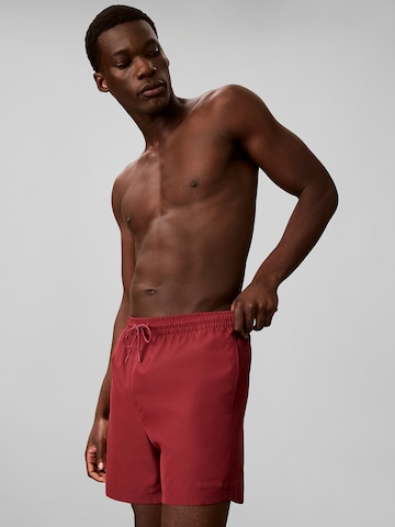 Calvin Klein Board Shorts in Red: front