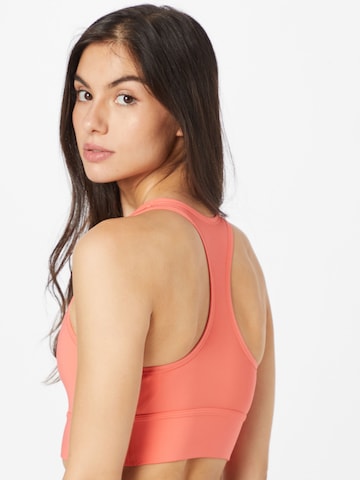 Bustino Reggiseno sportivo di NIKE in arancione