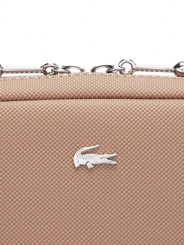 LACOSTE Axelremsväska i beige