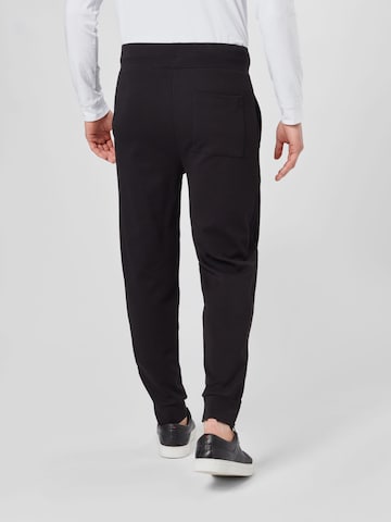 Tapered Pantaloni 'DUROS' di HUGO Red in nero