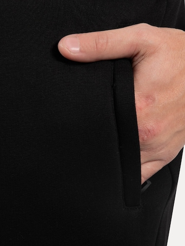 Effilé Pantalon Smilodox en noir