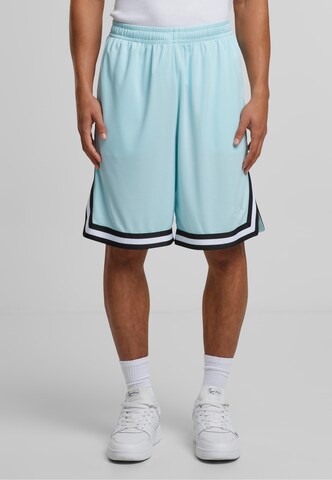 Karl Kani Loose fit Pants in Blue: front