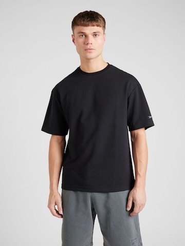 Reebok - Camiseta funcional en negro: frente