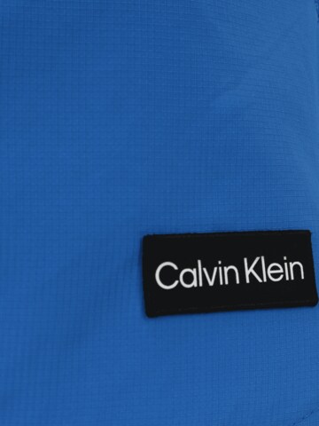 Calvin Klein Swimwear Plavecké šortky 'Medium Runner' - Modrá