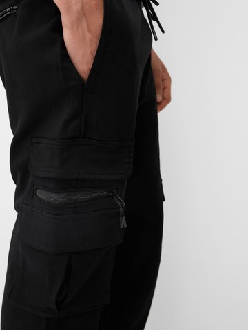 Bershka Tapered Cargo trousers in Black