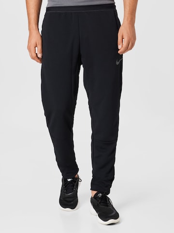 NIKE Regular Workout Pants in Black: front