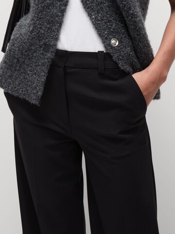 Wide leg Pantaloni con piega frontale di Marks & Spencer in nero