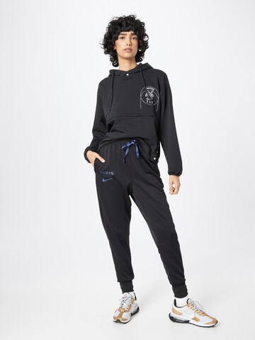 Effilé Pantalon de sport NIKE en noir