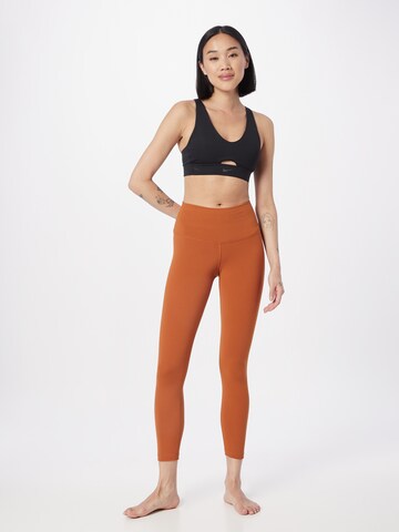NIKE Skinny Workout Pants in Orange