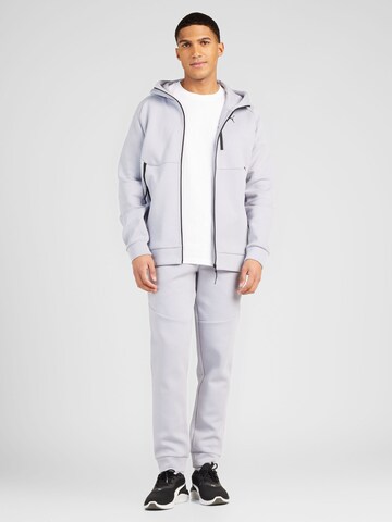 PUMA Tapered Urheiluhousut värissä harmaa