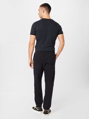 HOLLISTER - Tapered Calças em preto