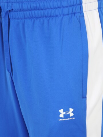 UNDER ARMOUR Tapered Sportbroek in Blauw