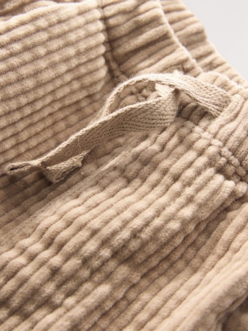 Next Zwężany krój Spodnie w kolorze beżowy