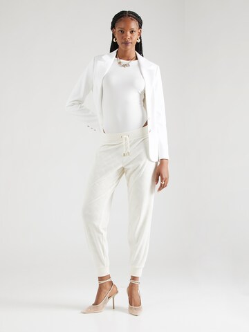 Juicy Couture Tapered Housut 'Pipa' värissä valkoinen