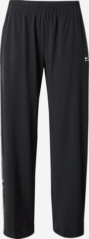 Loosefit Pantaloni sport de la NIKE pe negru: față