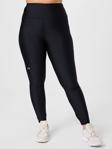 Skinny Pantalon de sport UNDER ARMOUR en noir : devant