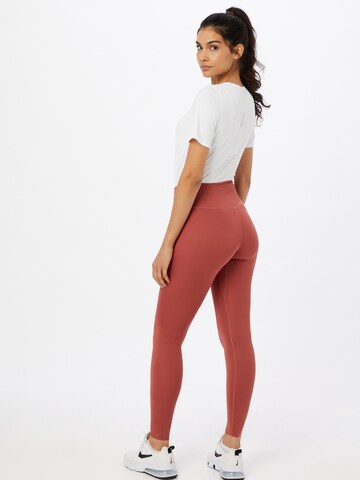 NIKE Skinny Urheiluhousut värissä ruskea