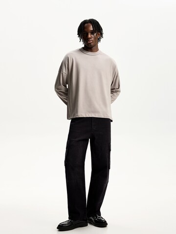 Loosefit Jeans cargo di Bershka in nero: frontale