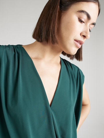 Trendyol - Blusa body em verde