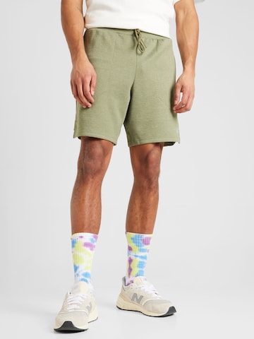 Regular Pantalon de sport new balance en vert : devant