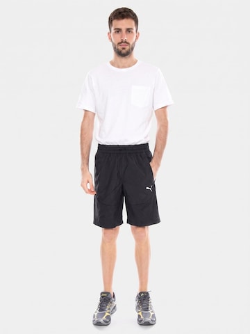 Baggy Pantaloni 'PUMATECH Woven Cargo Shorts' di PUMA in nero