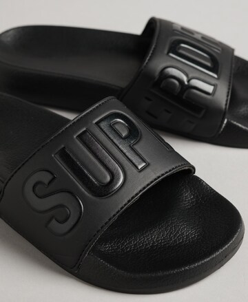 Claquettes / Tongs Superdry en noir