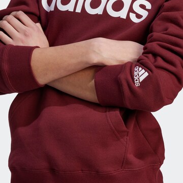 Sweat-shirt 'Essentials Linear' ADIDAS SPORTSWEAR en rouge