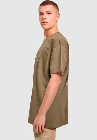 Merchcode T-Shirt 'Cupid´s Assistant' in Grün