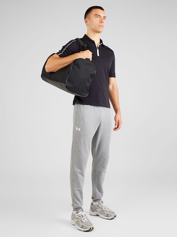 Tapered Pantaloni sportivi 'Rival' di UNDER ARMOUR in grigio