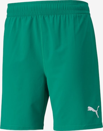 PUMA Workout Pants in Green: front