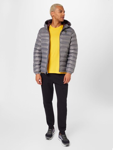 Champion Authentic Athletic Apparel Tapered Trousers in Black