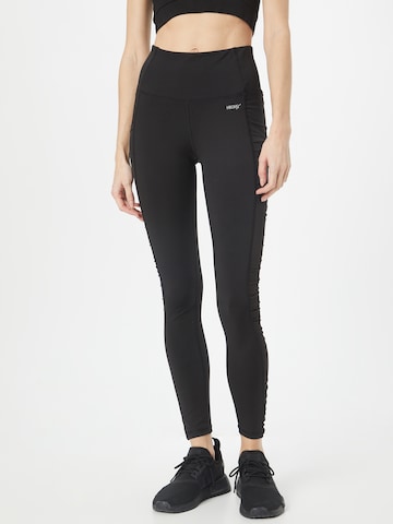 Skinny Pantaloni sport de la HKMX pe negru: față