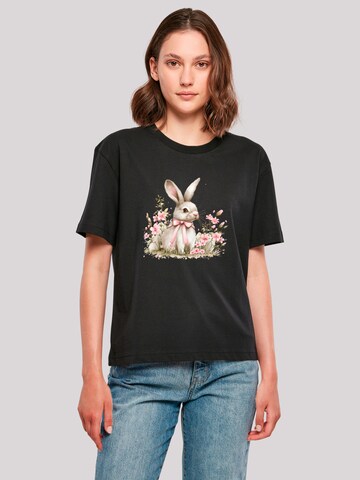 T-shirt 'Niedlicher Osterhase mit Blumen' F4NT4STIC en noir : devant
