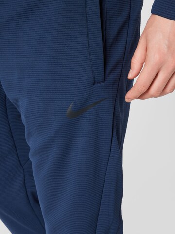 NIKE Regular Workout Pants in Blue