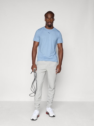 PUMA Конический (Tapered) Спортивные штаны 'Cloudspun' в Серый