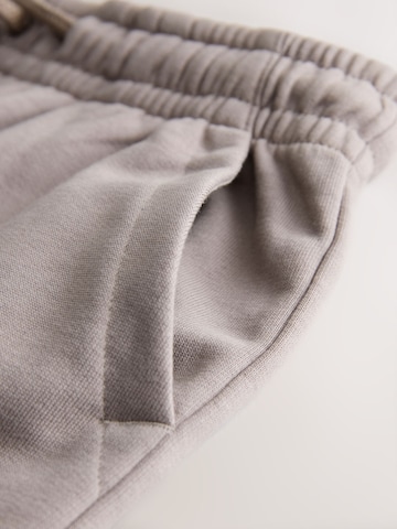 smėlio Next Plačios klešnės Kelnės