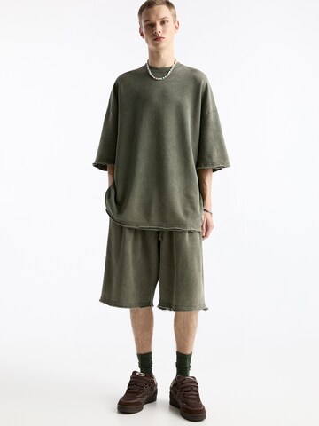 Bluză de molton de la Pull&Bear pe verde