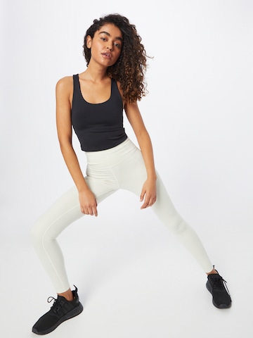 Girlfriend Collective Slimfit Sportovní kalhoty – béžová