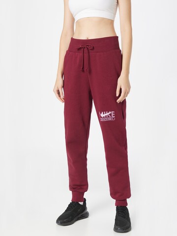 Nike Sportswear Tapered Pants in Red: front