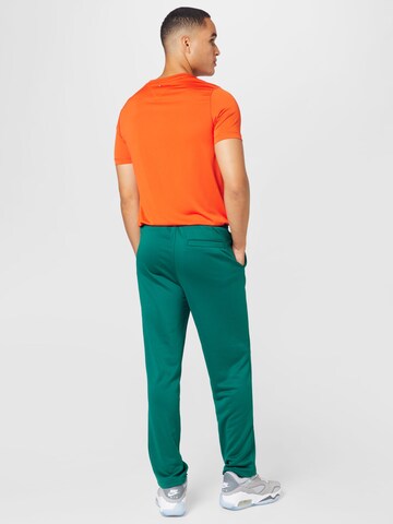 Tommy Jeans Regular Pants 'Ethan' in Green