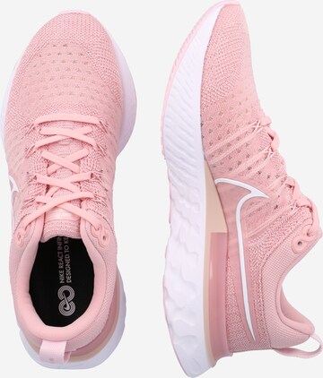 NIKE Běžecká obuv 'React Infinity' – pink