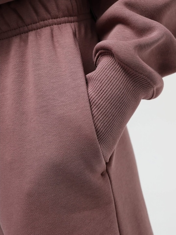 NIKE - regular Pantalón deportivo 'Nike Air Mid-Rise Fleece Jogger' en rosa