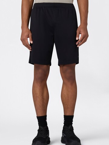 Regular Pantaloni sport de la Champion Authentic Athletic Apparel pe negru: față