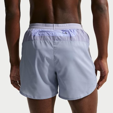NIKE Regular Workout Pants 'Stride Nvlty' in Purple